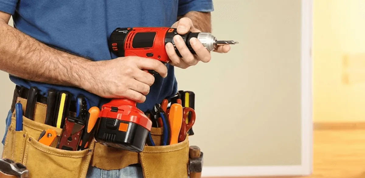 Handyman holding a power drill for home repairs and installations in Philadelphia, PA